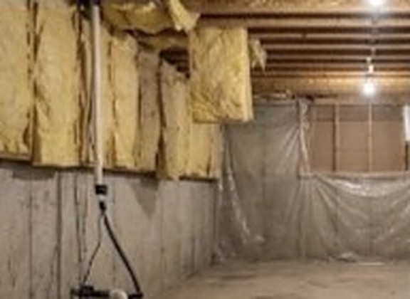 Unfinished basement before renovation